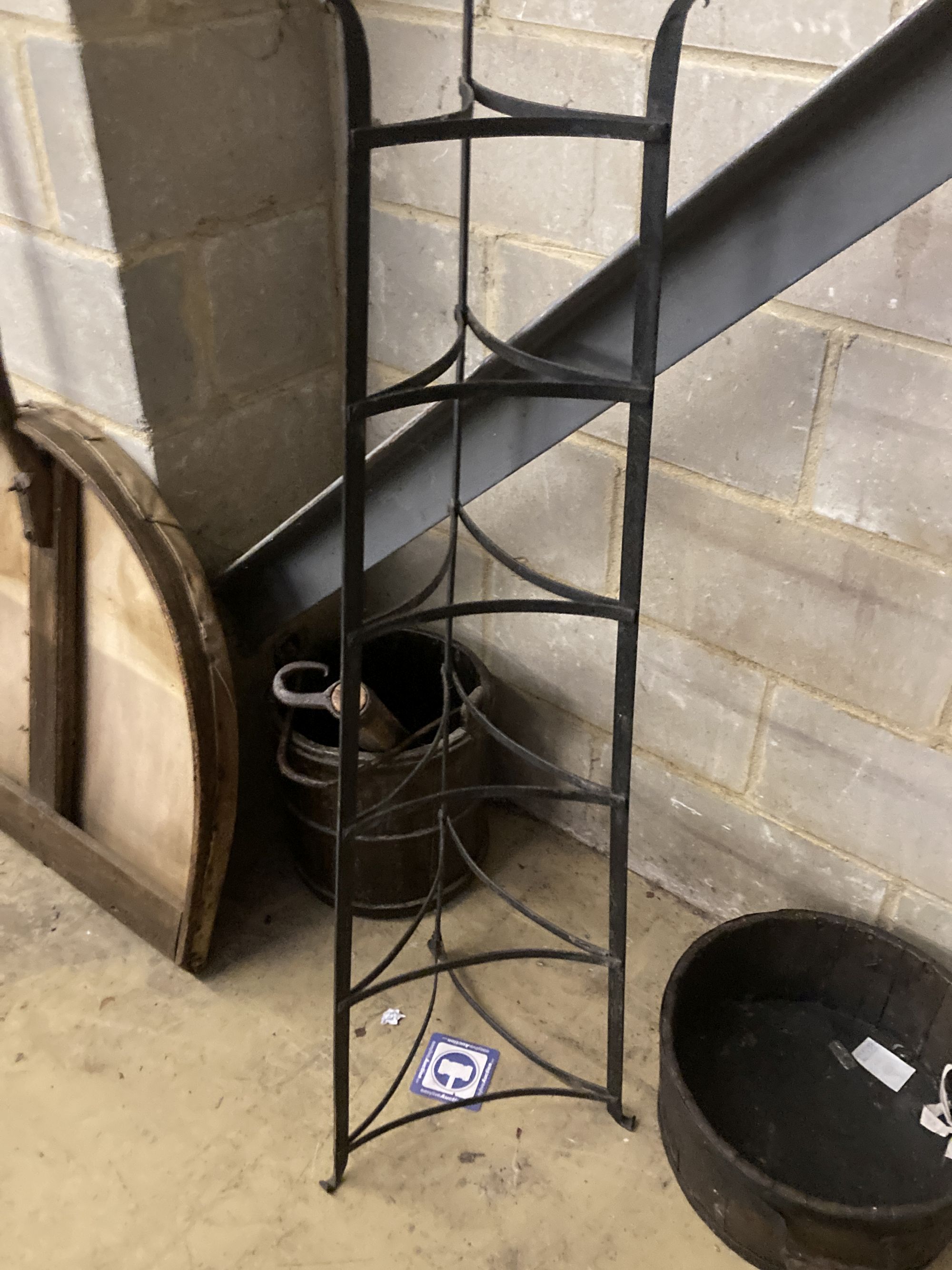 A Victorian mulch shovel, wrought iron pot stand and a yoke